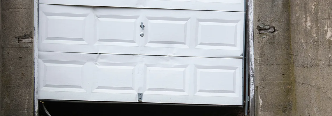 Garage Door Got Hit By A Car Dent Removal in Poinciana, FL